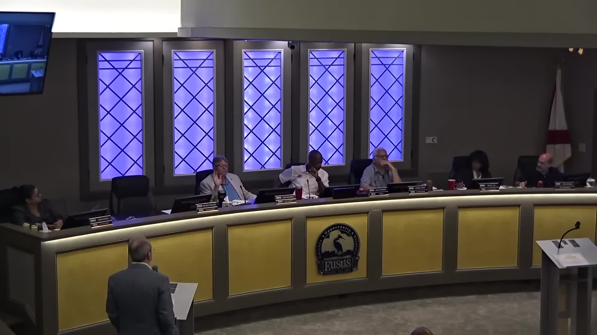 Commission directs staff to prepare public solicitation for community center site; title search pending