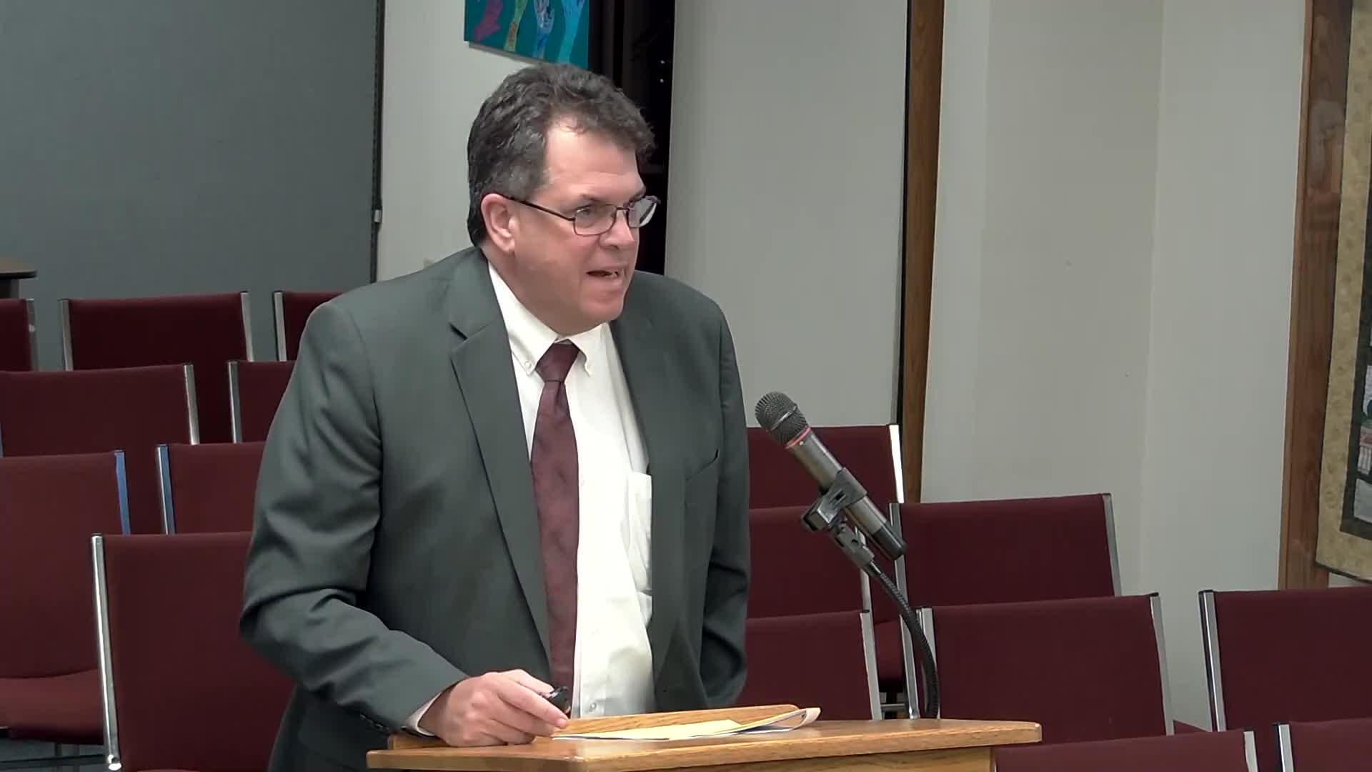 City accepts second‑quarter financial report; staff flags timing, revenue and expense variances