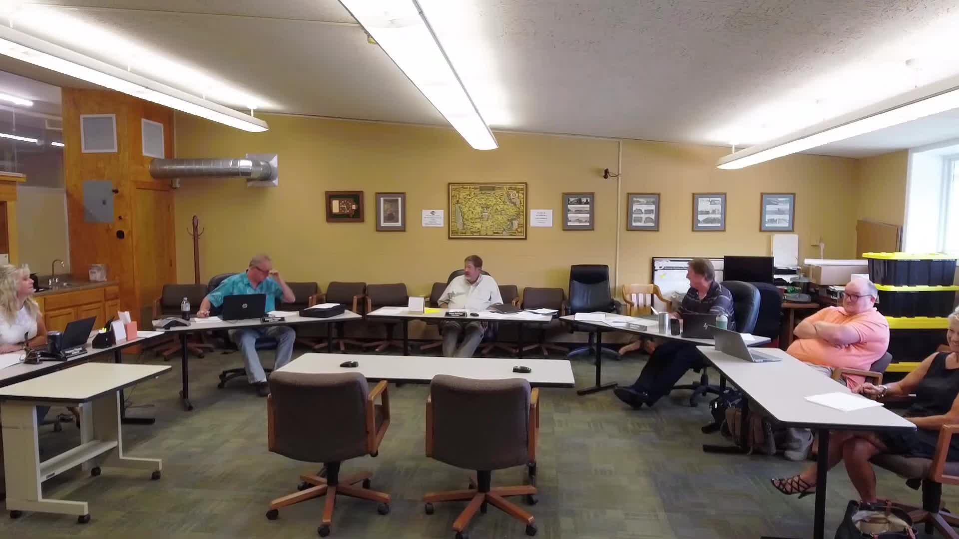 Board moves into closed session under Iowa Code 21.5(1) and issues verbal warning on employee evaluation