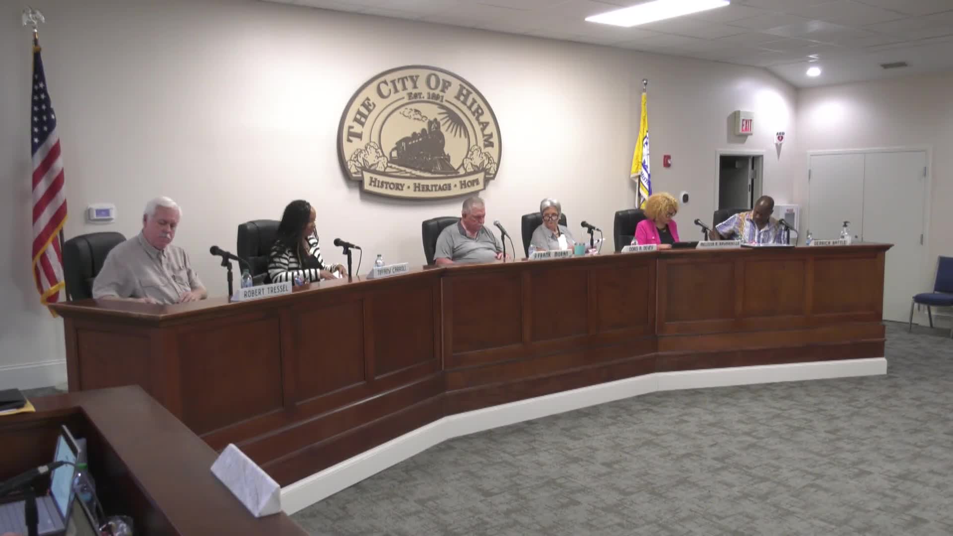 Council reviews employee handbook changes and a proposed switch in supplemental insurance to increase city‑paid life benefit