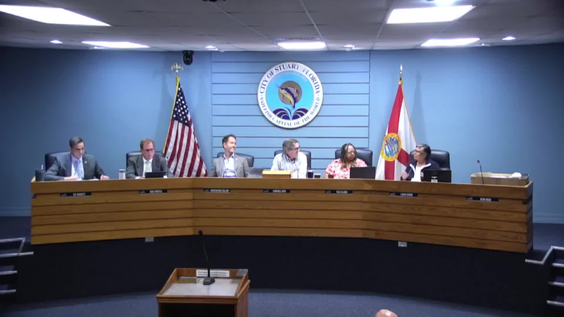 Commissioners raise parking, jurisdiction and shared‑use questions for proposed Brightline station at county courthouse lot