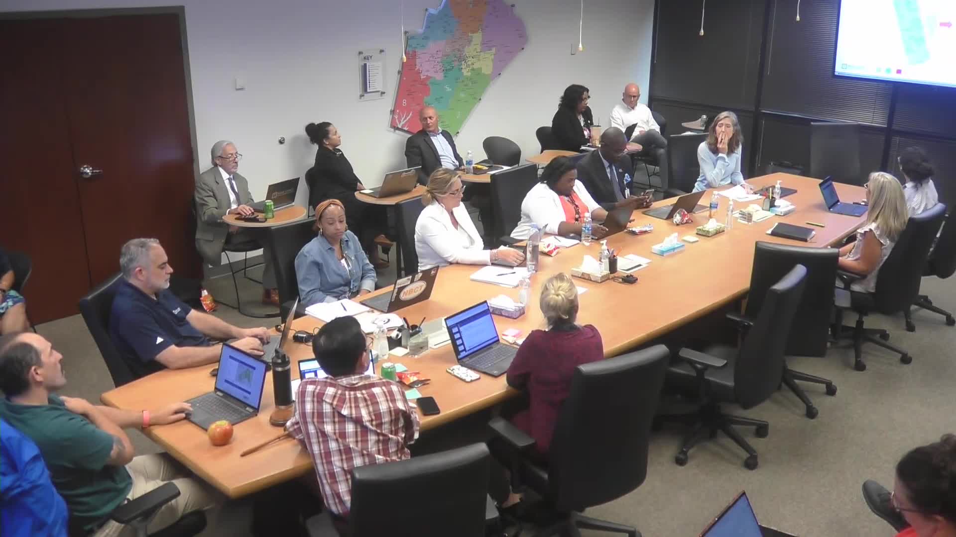 Community Meeting Reviews New High School Parking Deck Design and Student Safety Measures