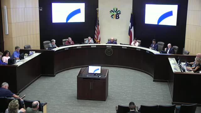 Father David Chaka leads invocation at city council meeting