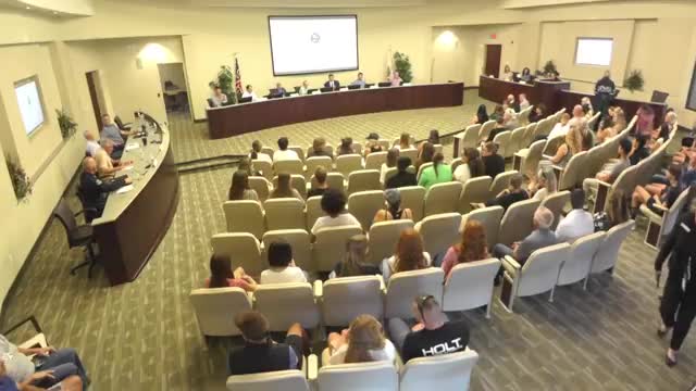 Community Meeting Opens With Pledge of Allegiance and Invocation