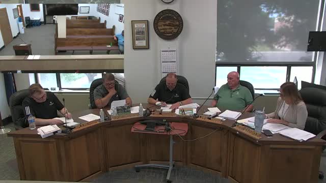 Commission to hire compliance service for bond disclosures; fee to be paid from bond proceeds