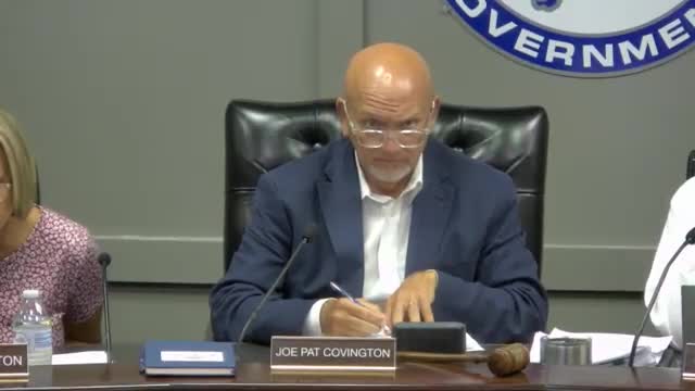 Scott County Fiscal Court approves fire‑board proposal to consolidate officer ranks after heated public comments