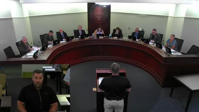 Resident urges county to reverse ban on photographing public records; executive says petitions will be posted online next year