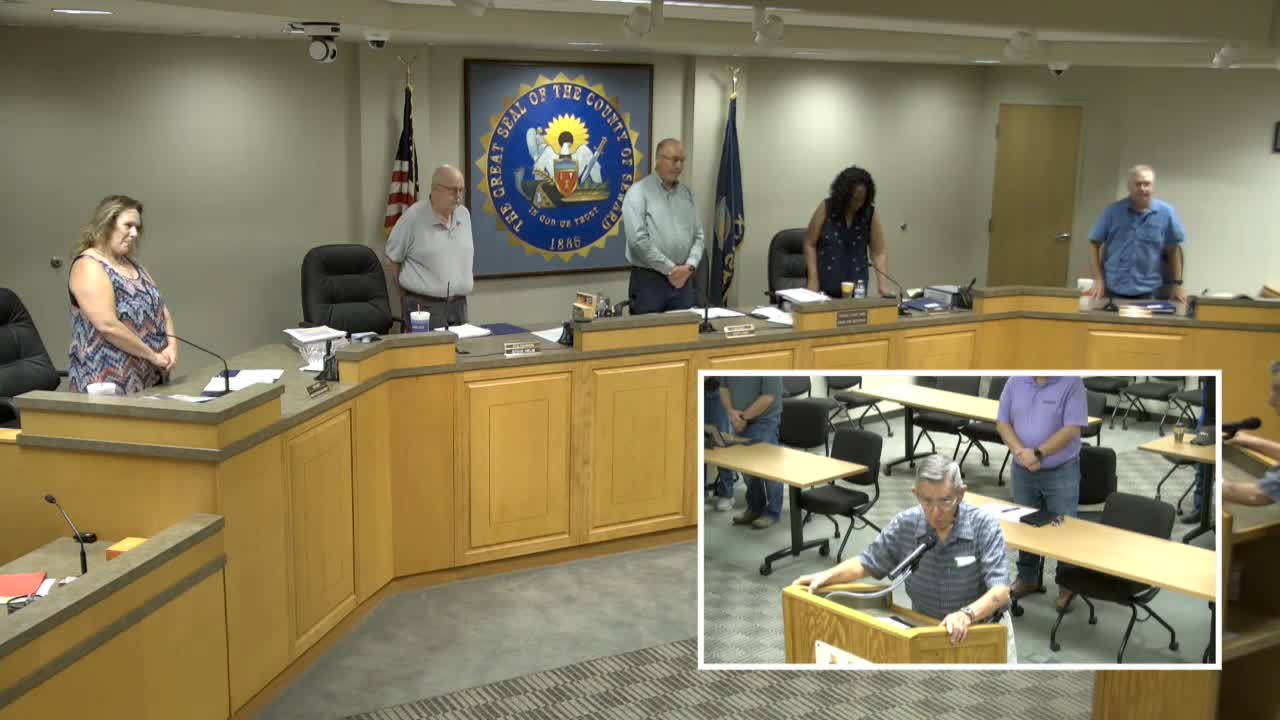 Commissioner April leads prayer of gratitude for county service and professionalism