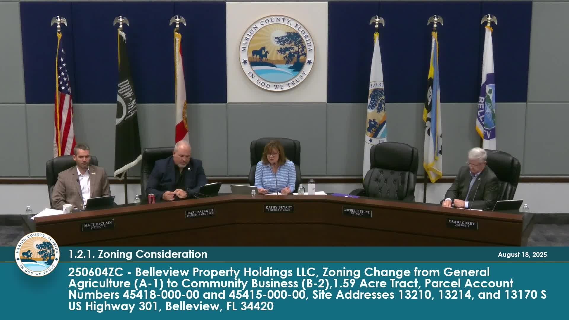 Commissioner Curry questions applicant about dark sky lighting during public meeting