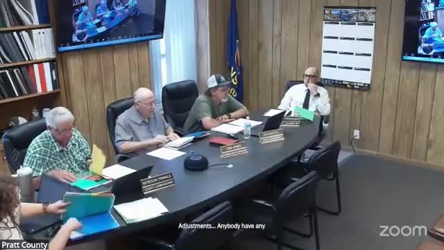 Commission discusses internal budget adjustments and pending audit draft