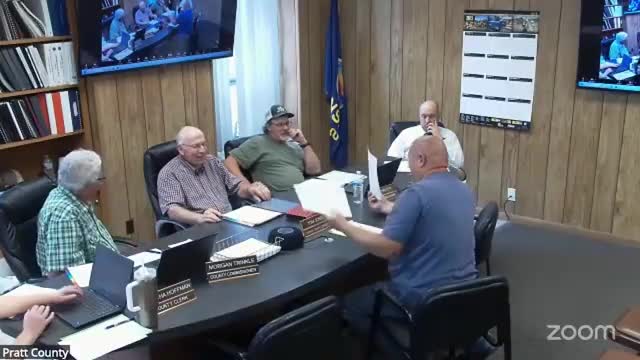 Commission raises two employee wages, approves online job application and discusses communications card policy