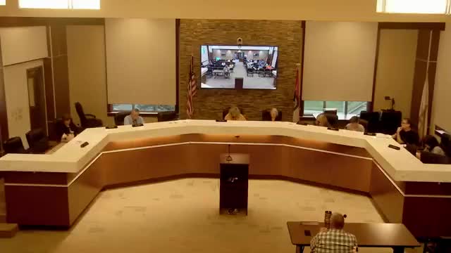 Council amends and tables food‑truck ordinance after debate over proximity to brick‑and‑mortar businesses and enforcement