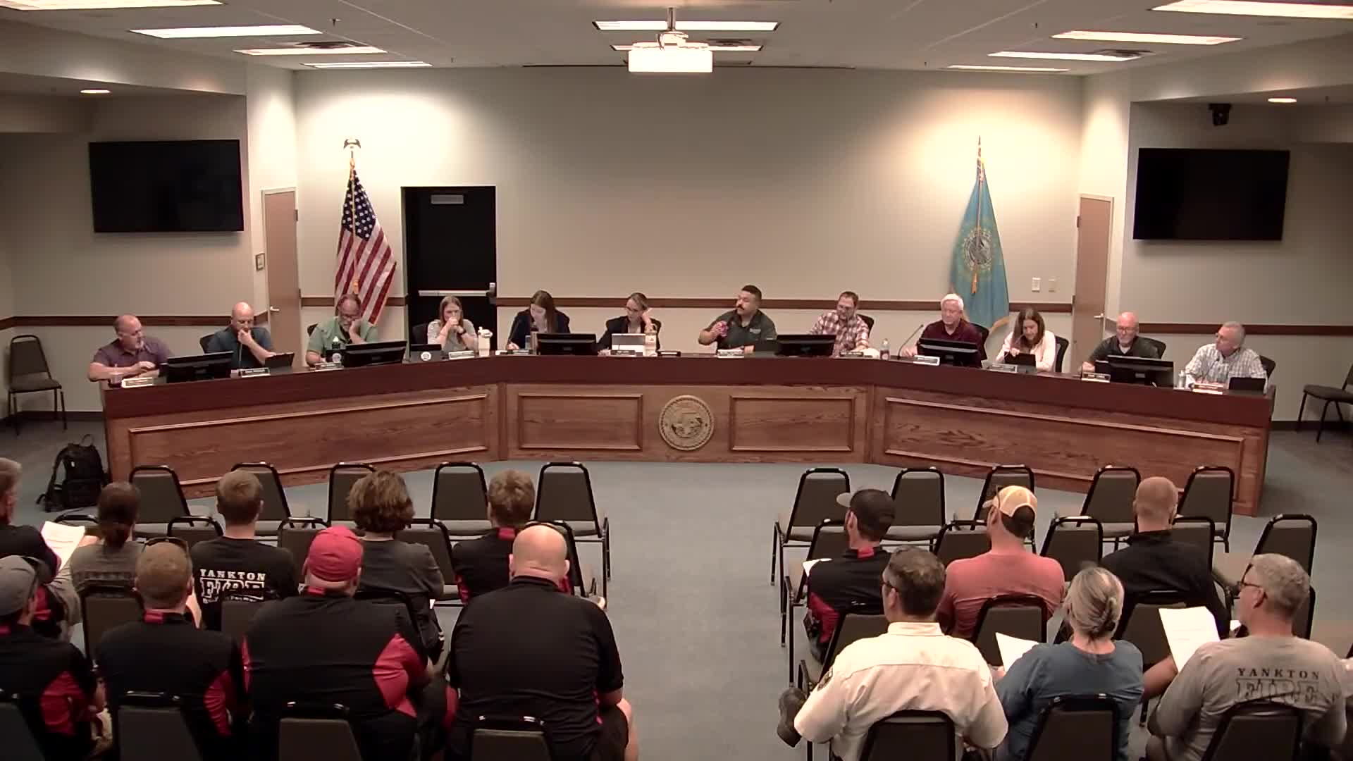 Fire Chief Linky discusses engine color change and budget concerns at commission meeting