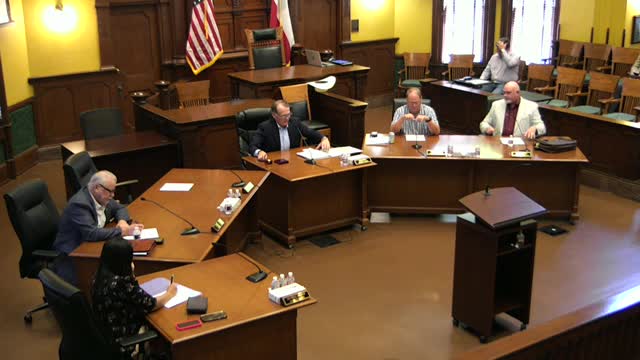 Commissioner Kyle Butler leads invocation at county meeting on new e-poll books
