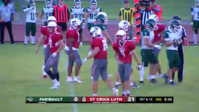 Coach Frey evaluates team mistakes during critical high school football match
