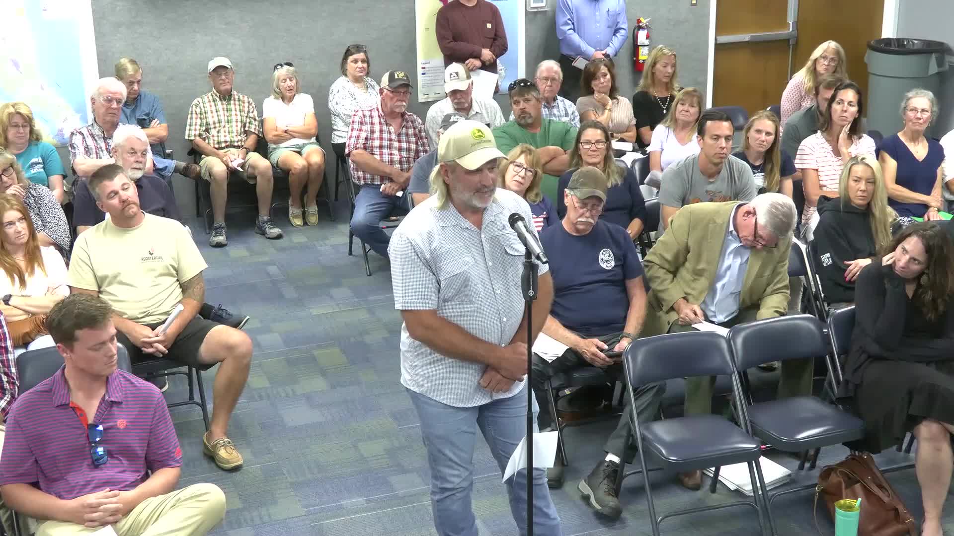 Local Farmer Challenges Permit Process and Contract Breach in Zoning Meeting