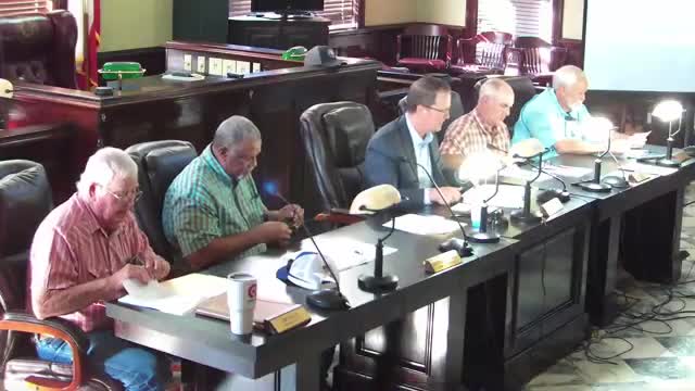 Public criticizes proposed full‑time secretaries as commissioners approve job description funded from precinct budgets