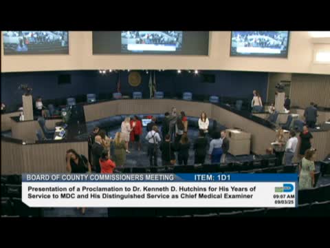 Commissioner Bastien addresses crowd amid disruptions at public meeting