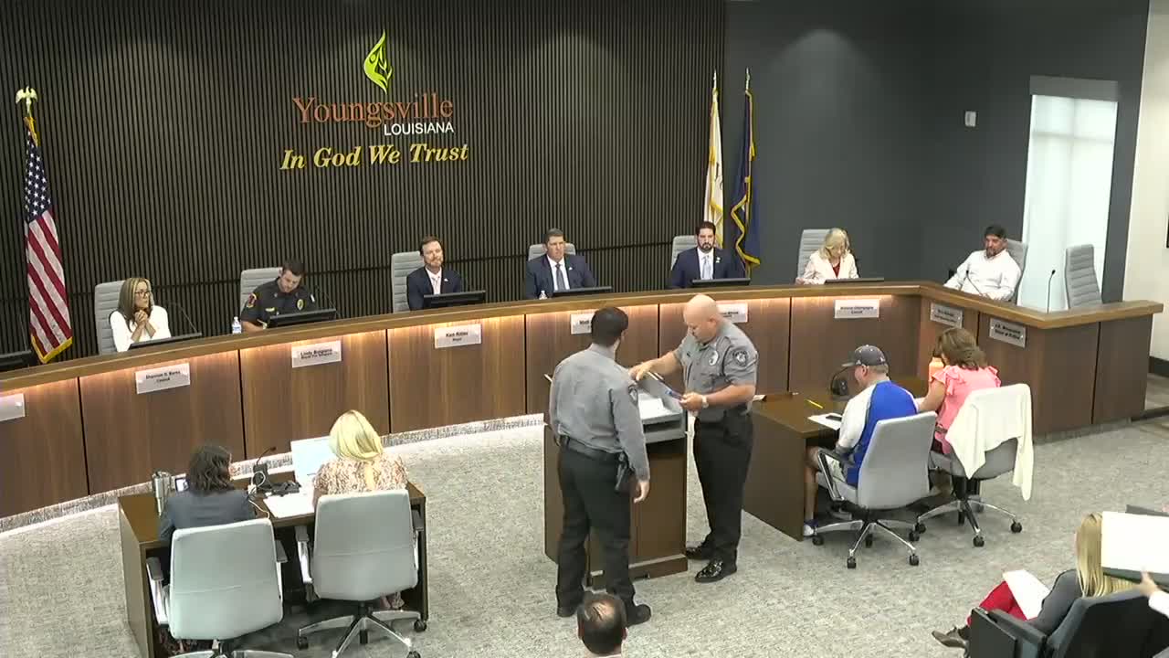 Officer and first‑responder crew credited with saving electrocution victim; council recognizes team