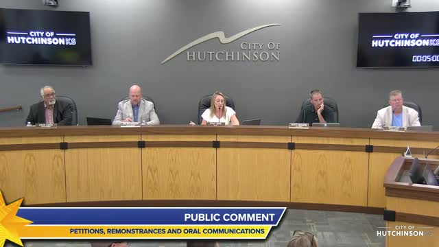 Resident presses Hutchinson council on neighbor’s yard: pallets, electric fence and outhouse cited