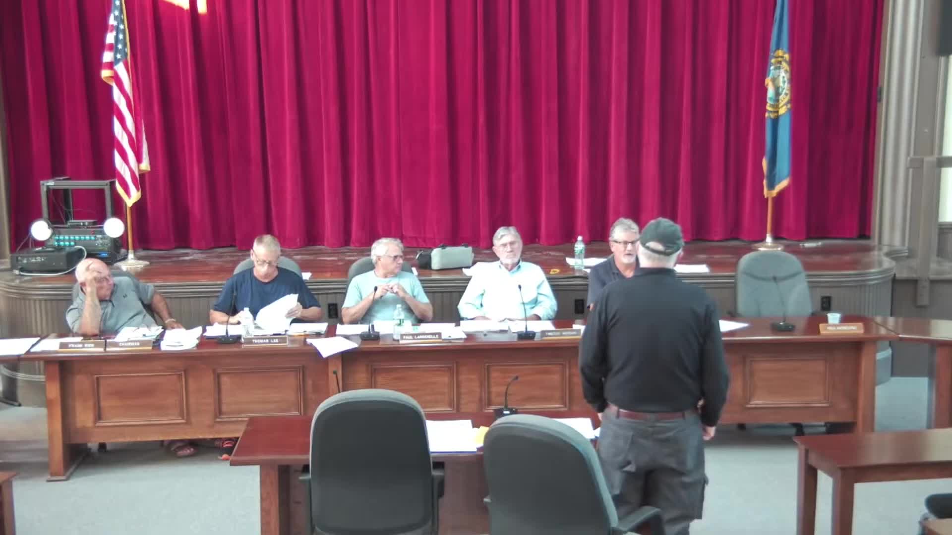 ZBA approves roof‑raise and septic relief at Half Moon Lake cottage; conditional permits require state septic approval