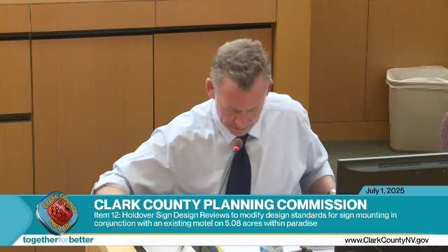 Commission approves redesigned freestanding motel sign after applicant agrees to cladding and off‑site advertising limits