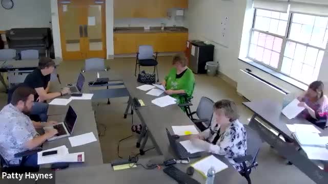 District to align extracurricular eligibility language with NHIAA and state statute; birth‑certificate language changed to 'official'