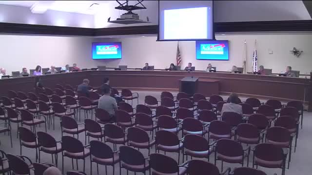 Board approves purchases of two electric community development vehicles and one police non‑pursuit vehicle; waives formal bid process