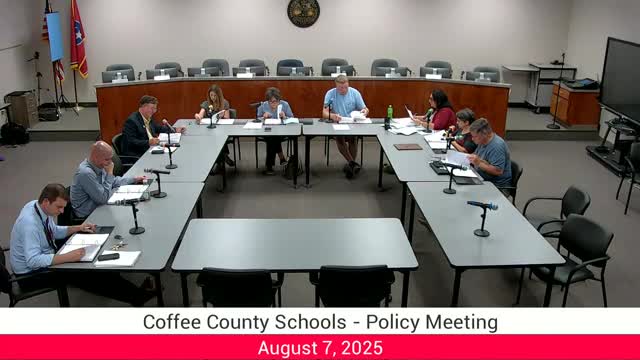 Board inserts state-required antisemitism definition into discrimination policies and updates library‑materials language