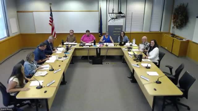 Board refers proposed AI‑use policy to policy committee after staff presentation