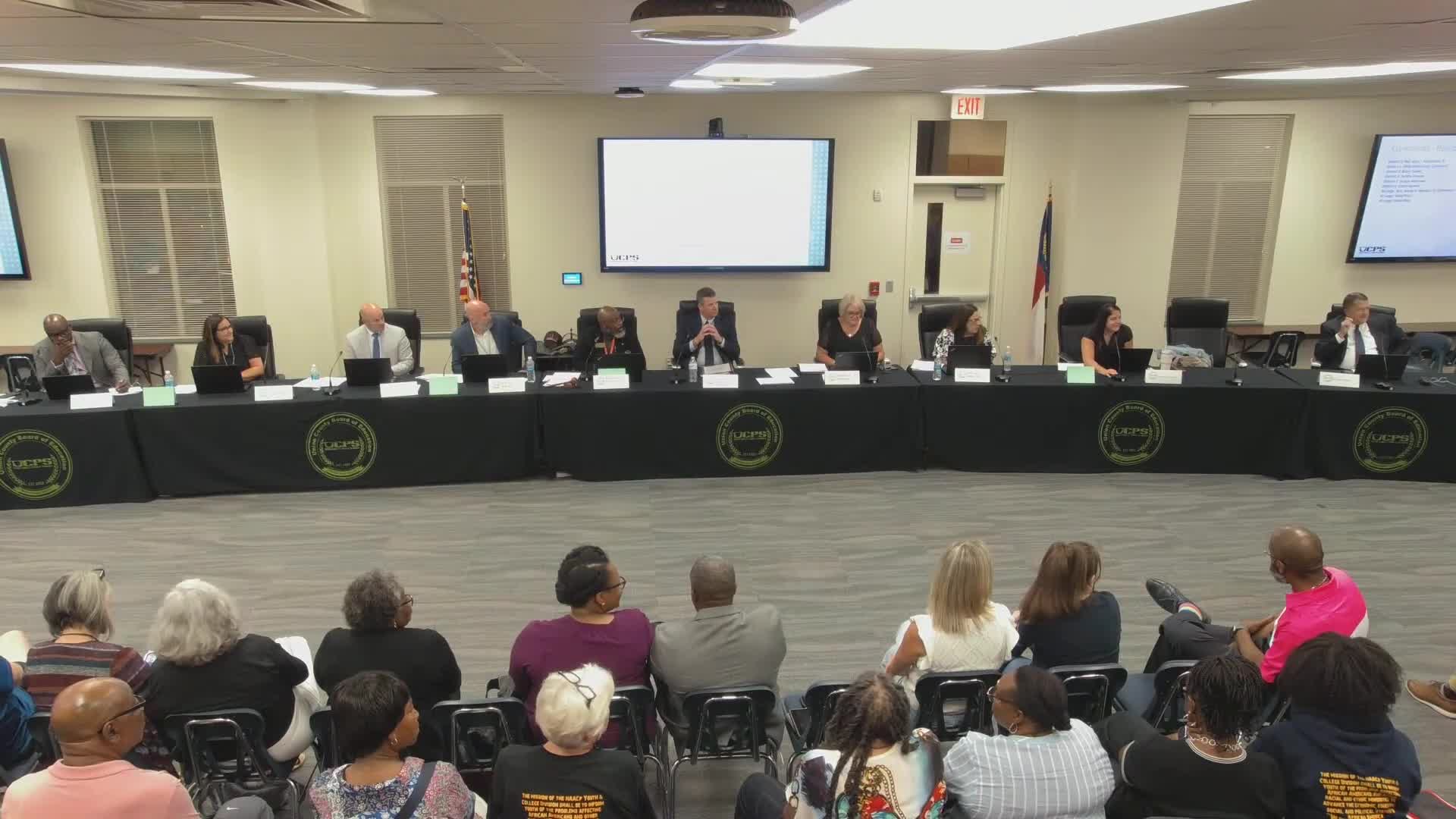 Board member reads resolution urging restored funding for public schools; board will review at a future date