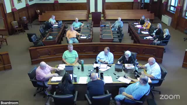 County to place finance director under county administrator; financial policies updated to match operations