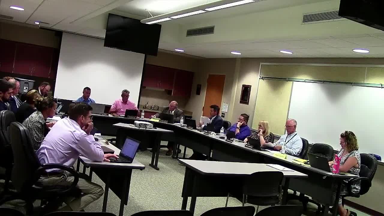 Board approves 90‑day project manager and continued McGraw‑Hill math pilot; vote recorded with two opposing members