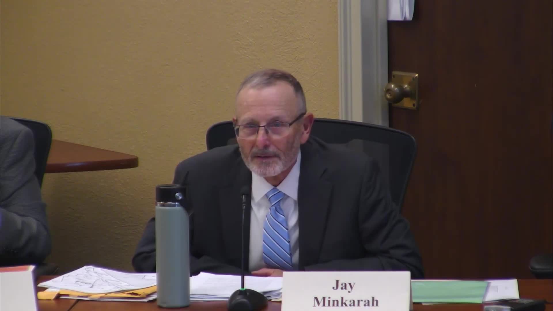 ZBA grants after‑the‑fact driveway width variance for multifamily property at 33 Harvard Street