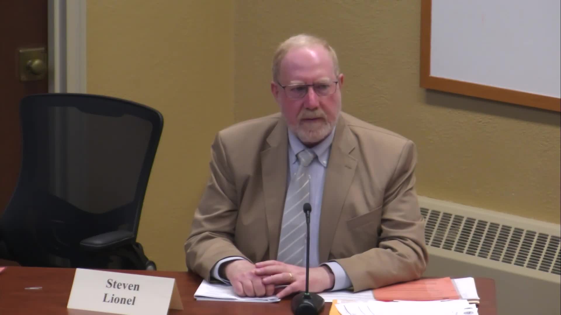 Board OKs small rear-yard encroachment to convert deck to three‑season porch at Waters Edge Drive