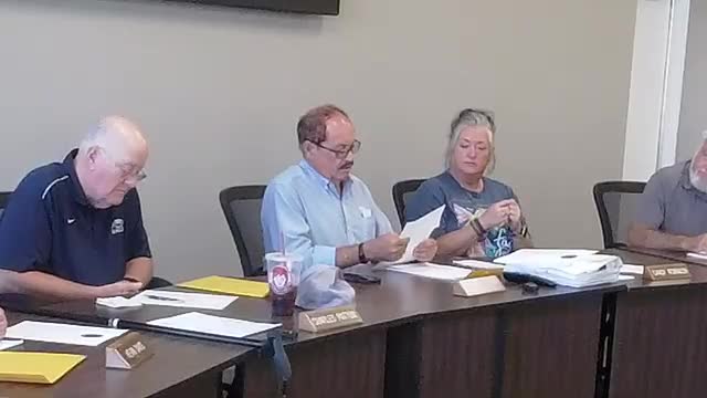 Council defers decision on brush truck bid, orders follow‑up on downtown lights; approves surplus sale and planning‑board appointment