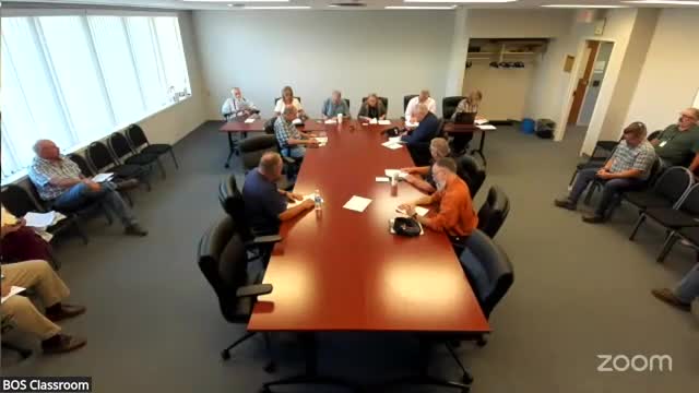 County clerk raises passport photo fee, warns of deed‑fraud scams and expands town digitization support