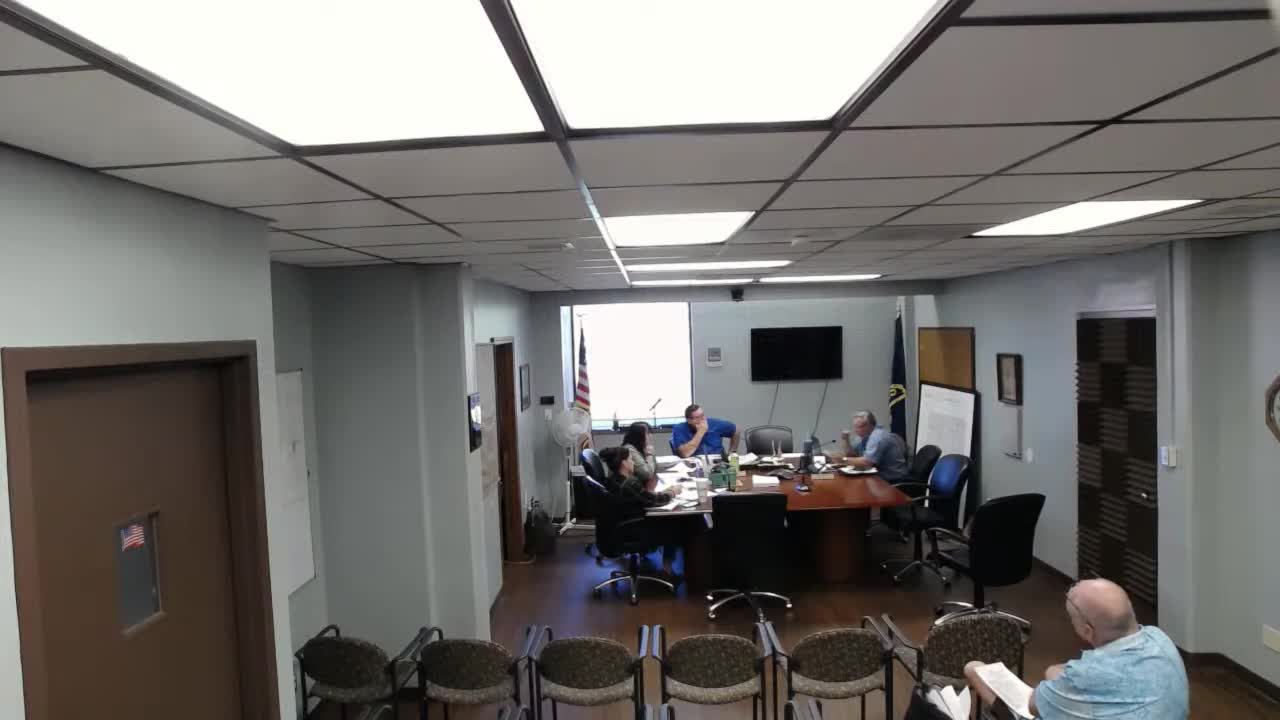 Commissioners consider one‑year flat budget to shore reserves; ask for three budget snapshots by Monday