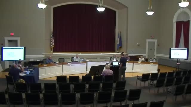 Planning board approves transit center electric bus chargers with decommissioning and lease conditions; one member opposes