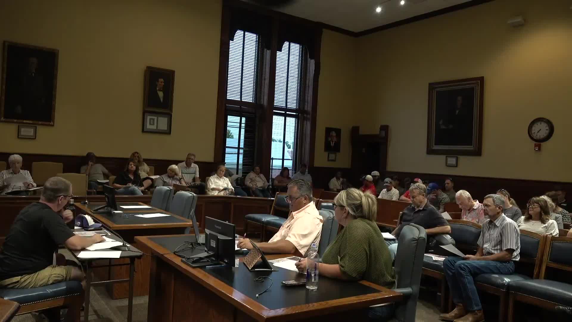 Board amends public-transportation budget lines; treasurer and commissioners press for clear accounting