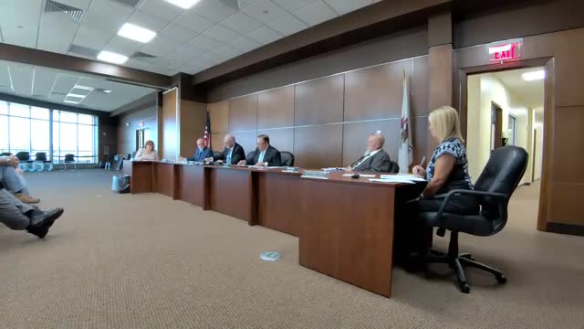 County to address building drainage and gutter failures after water intrusion near entrance; repair estimate cited