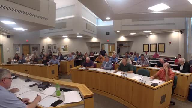 Executive committee approves Item 1 after discussion of litigation risk tied to state public act