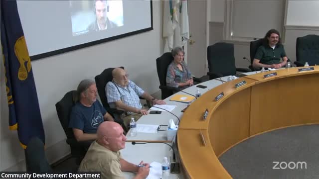 Commission advises staff that front/back deck repairs on noncontributing multifamily property can be processed as a minor alteration