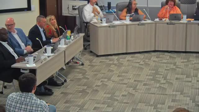 Board adopts FY26 budget, adds middle-school wrestling and a district roofer despite $18M shortfall