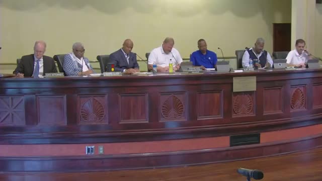 Council authorizes employee insurance order; member urges competitive bids