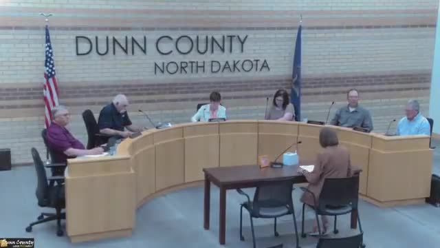 Commissioners table merit-scale decision; debate over merit raises vs. flat bonuses