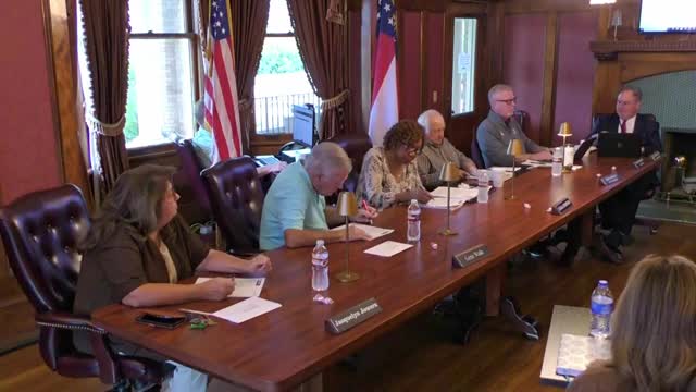 Board schedules executive session to discuss personnel, evaluations and school safety; raises question about on-duty weapon prohibition