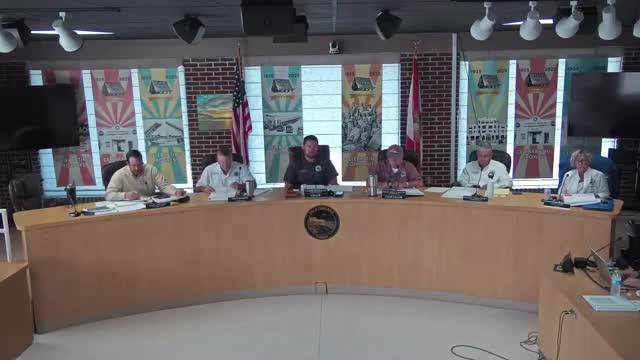 Staff present fully loaded costs for new positions; officials consider used bucket trucks to reduce capital spending