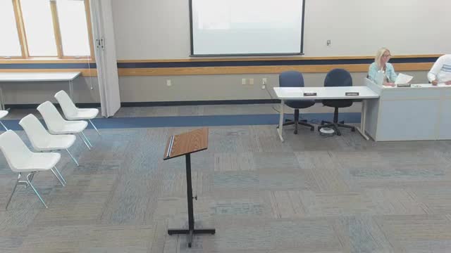 Board approves warrants and hears financial report noting large insurance cost and a small decline in local sales‑tax receipts