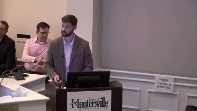 Home2 by Hilton rezoning draws mixed staff caution and broad public support; board seeks changes to buffer, grade and elevations